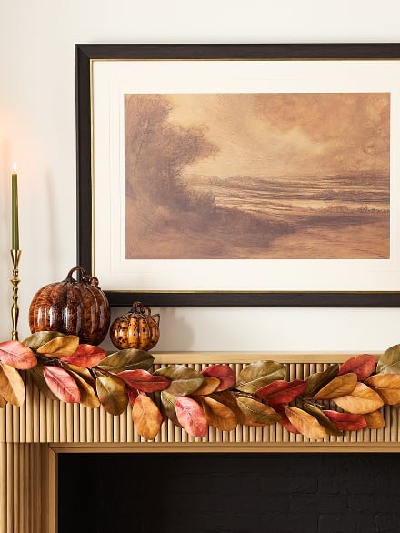 Fall leaf garland with decorative pumpkins on a mantel