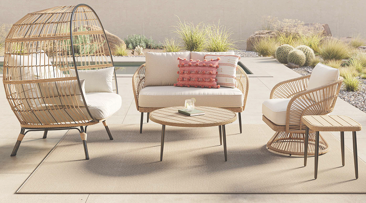Outdoor patio seating set with woven chairs and sofa