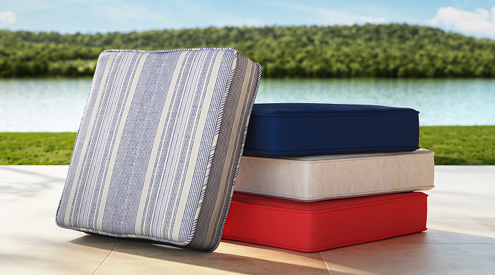 Stack of red, white and blue outdoor cushions
