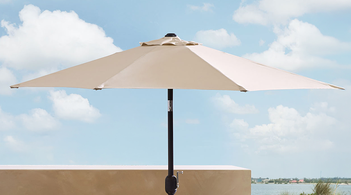 Patio umbrella over outdoor lounge seating