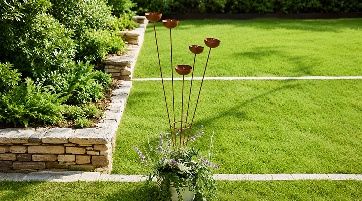 Outdoor yard stakes in a garden planter