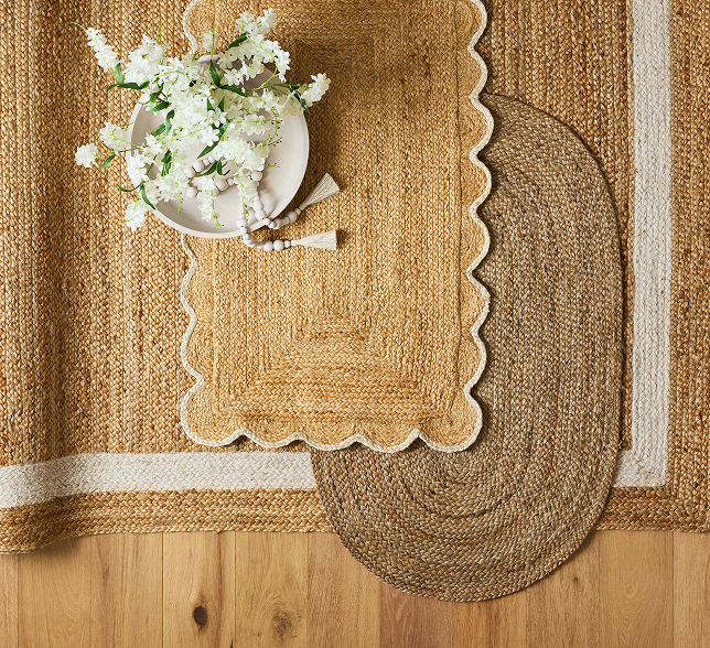Layered natural-fiber rugs in warm neutral tones
