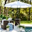 Highland Brown Wicker with Sand Cushions Swivel Patio Armchair